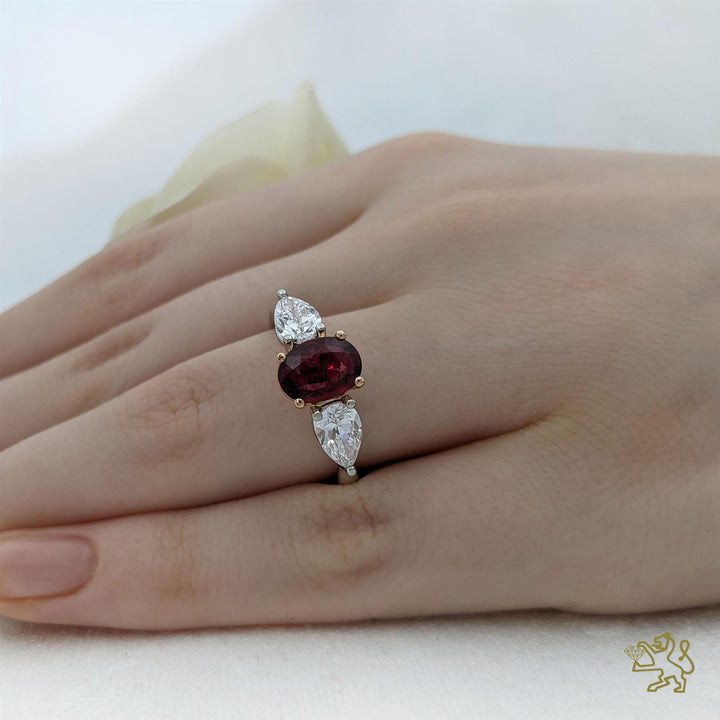 Florentine Oval Three Stone 1.62ct Ruby Platinum/Rose Gold Ring - Michael Jones Jeweller